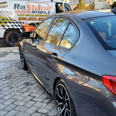 BMW M5 alongside the Rashine Mobile trailer
