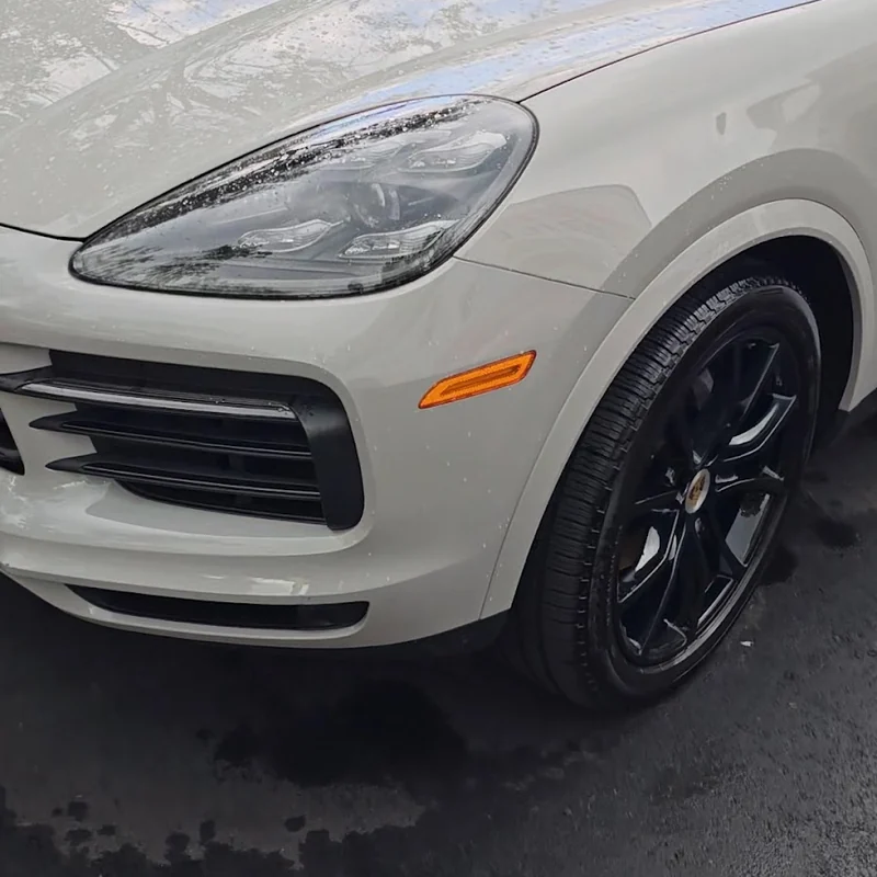 A white Porsche Cayenne detailed by Rashine