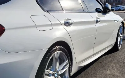 A white BMW 6 Series Gran Coupe, clean flank and wheel