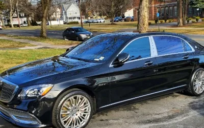 A black Mercedes-Maybach S-Class detailed at the curb